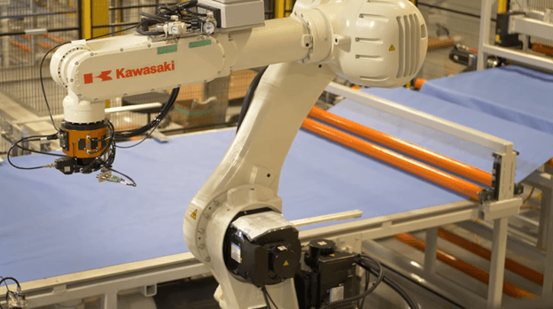 Kawasaki robot, equipped with a cutting tool, cuts out medical gown